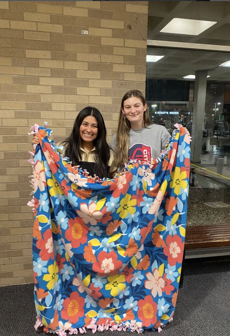 Participants holding a blanket