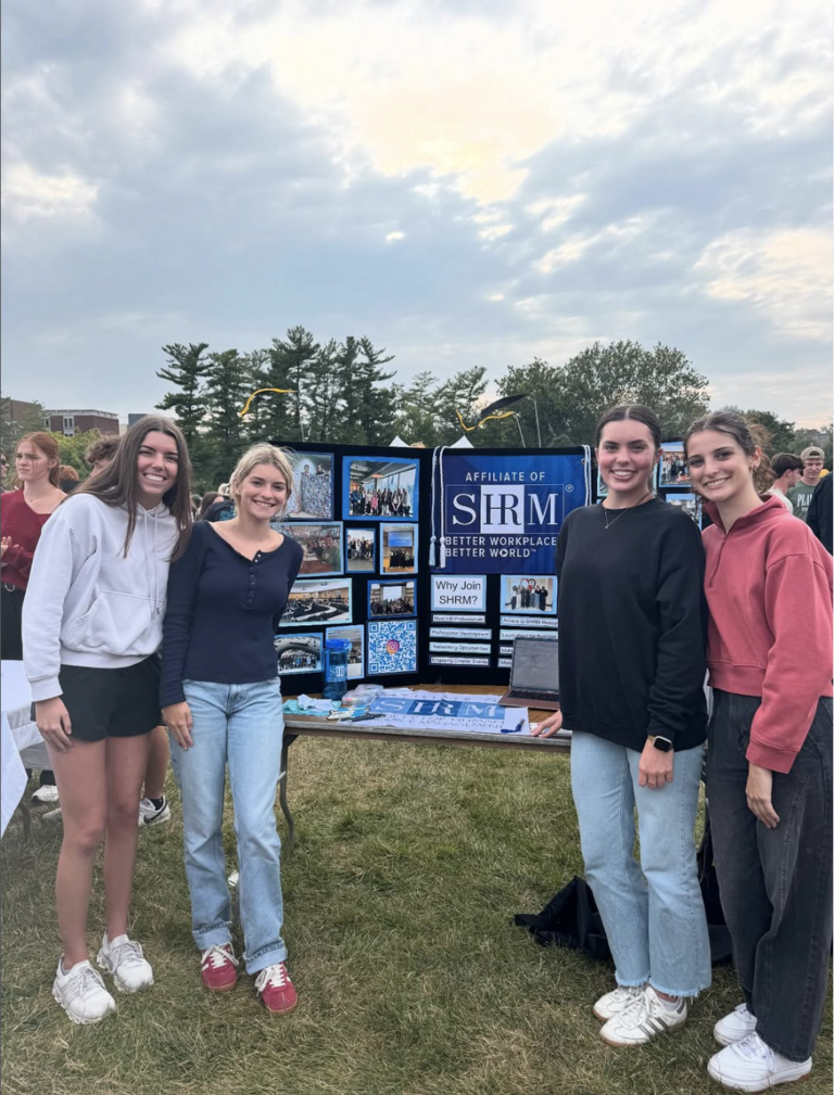 Participants in front of presentation at an outdoor event