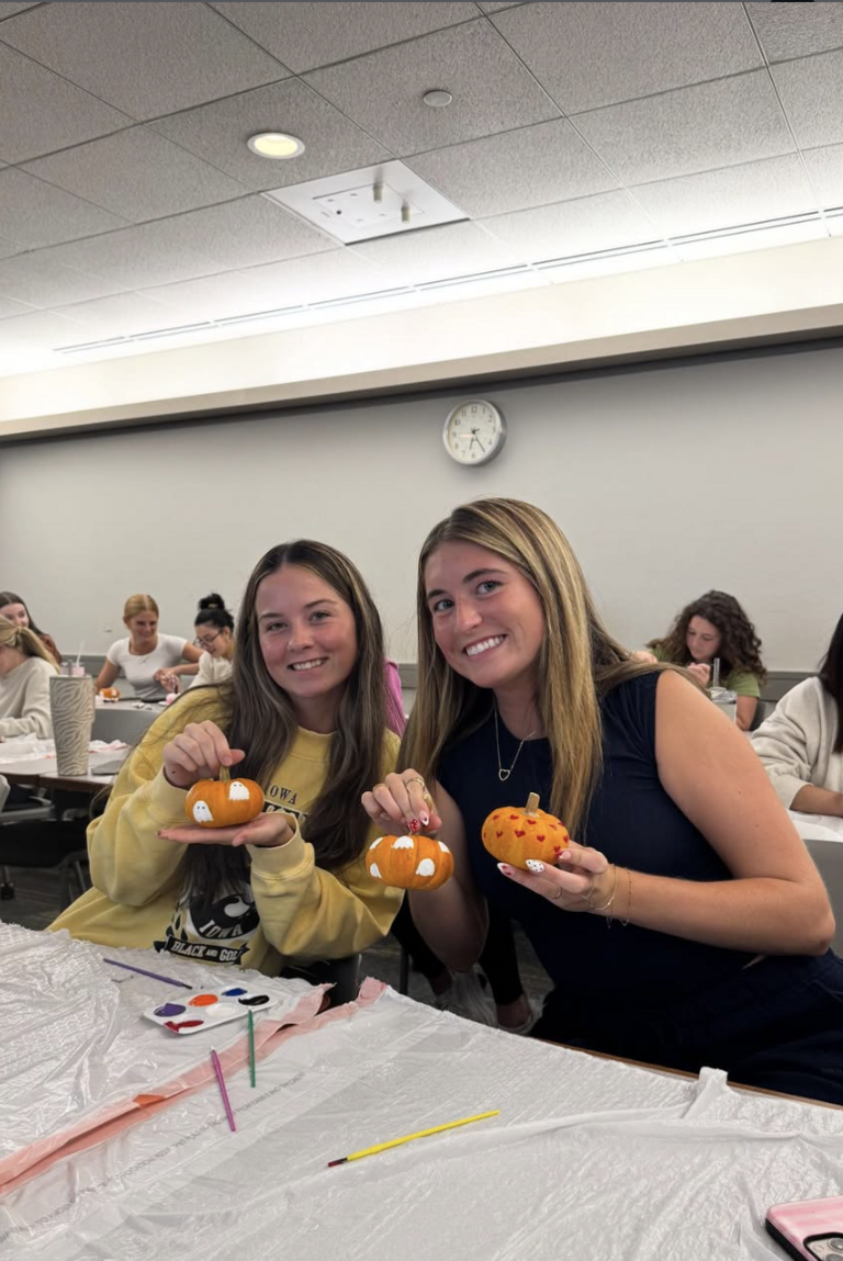 Participants at an event with pumpkins
